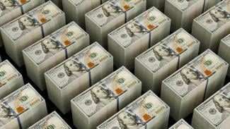 Stacks of hundred dollar bills are shown by Logan Voss courtesy of Unsplash.