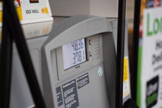 a close up of a gas pump at a gas station by Krzysztof Hepner courtesy of Unsplash.