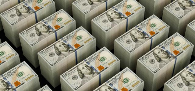Stacks of hundred dollar bills are shown by Logan Voss courtesy of Unsplash.