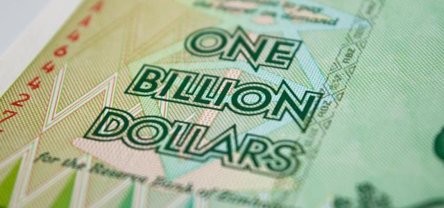 a one billion dollar bill with the words one billion dollars printed on it by Rob courtesy of Unsplash.